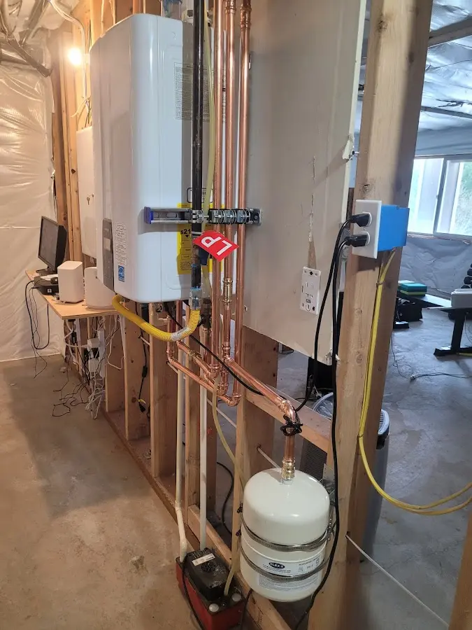 Licensed plumber repairing a kitchen sink in Springdale
